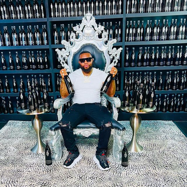 djdadon sitting in a chair in the music industry